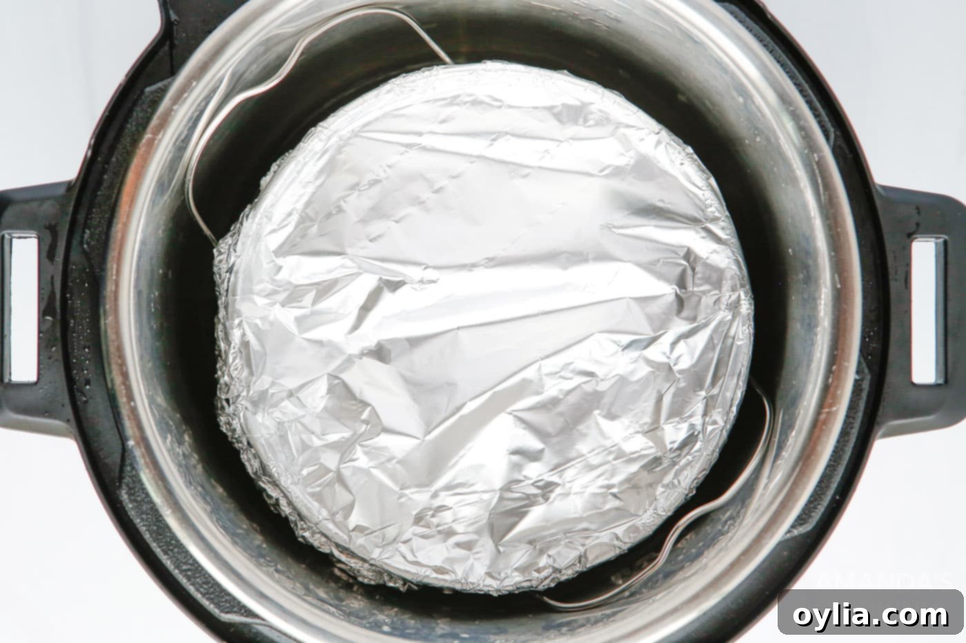 cheesecake wrapped in aluminum foil in the instant pot