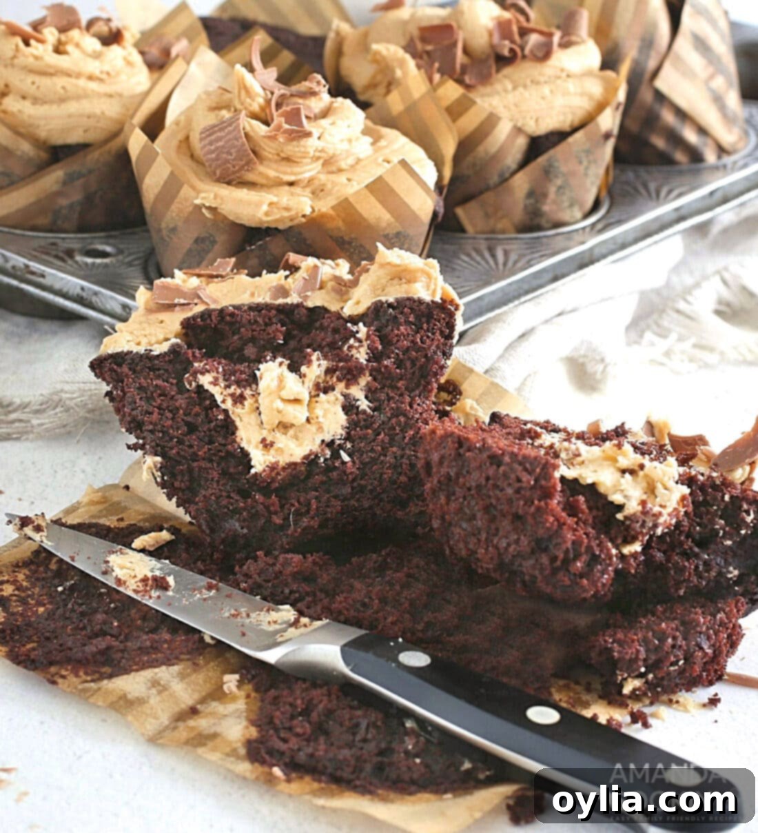 Chocolate Peanut Butter Cupcake cut open to reveal peanut butter filling