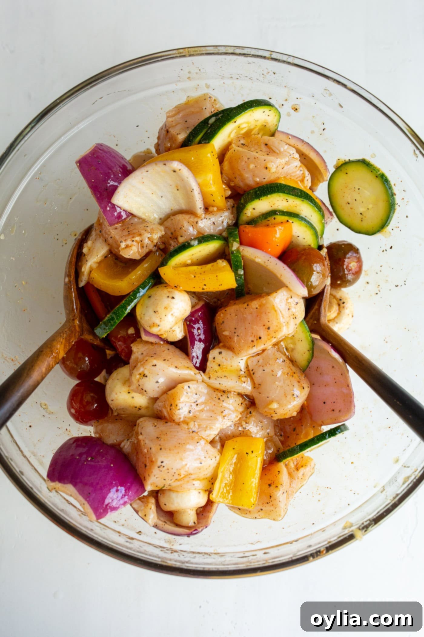 Chicken and veggies in a bowl with marinade