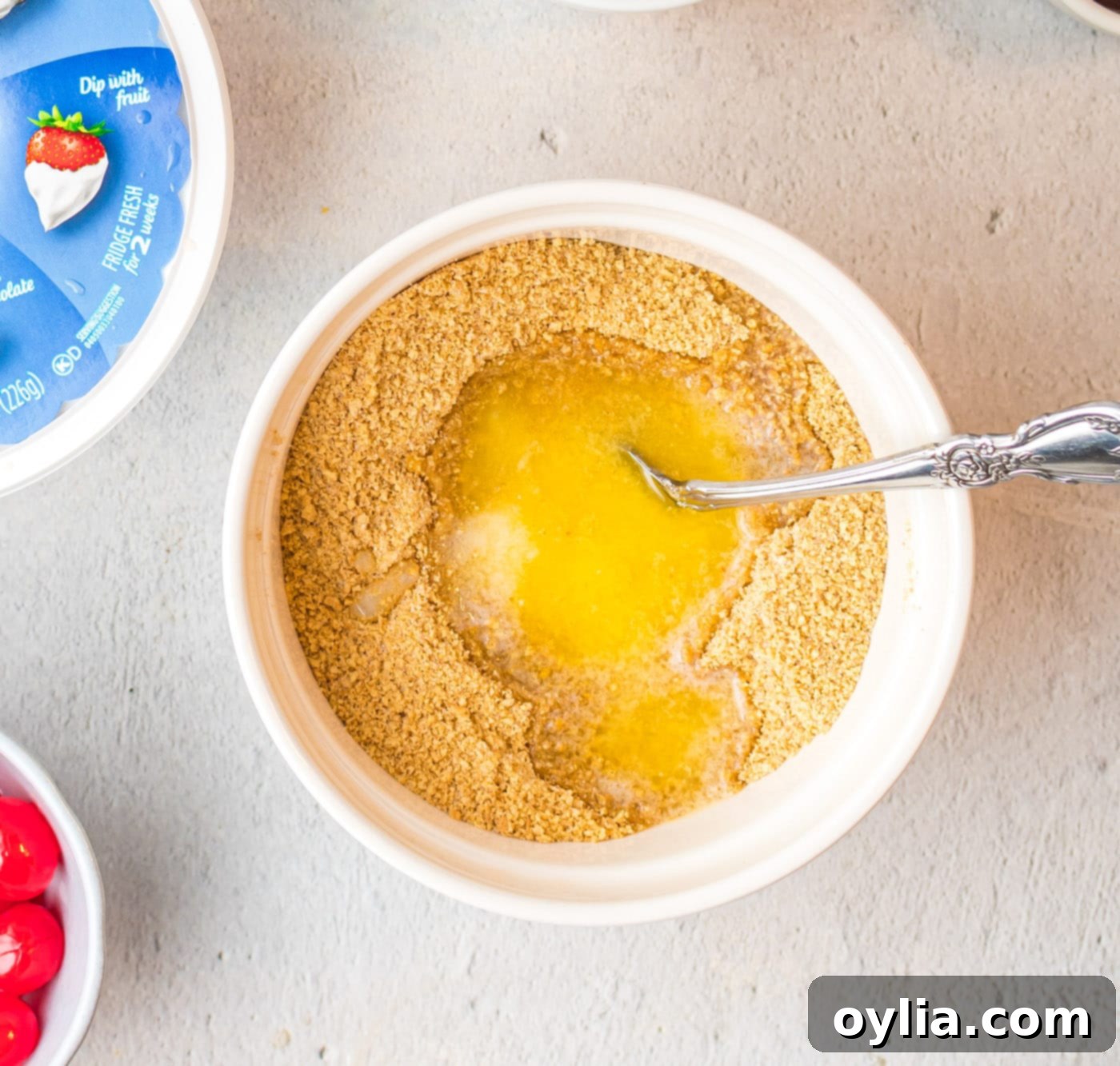 graham crackers and butter in a mixing bowl