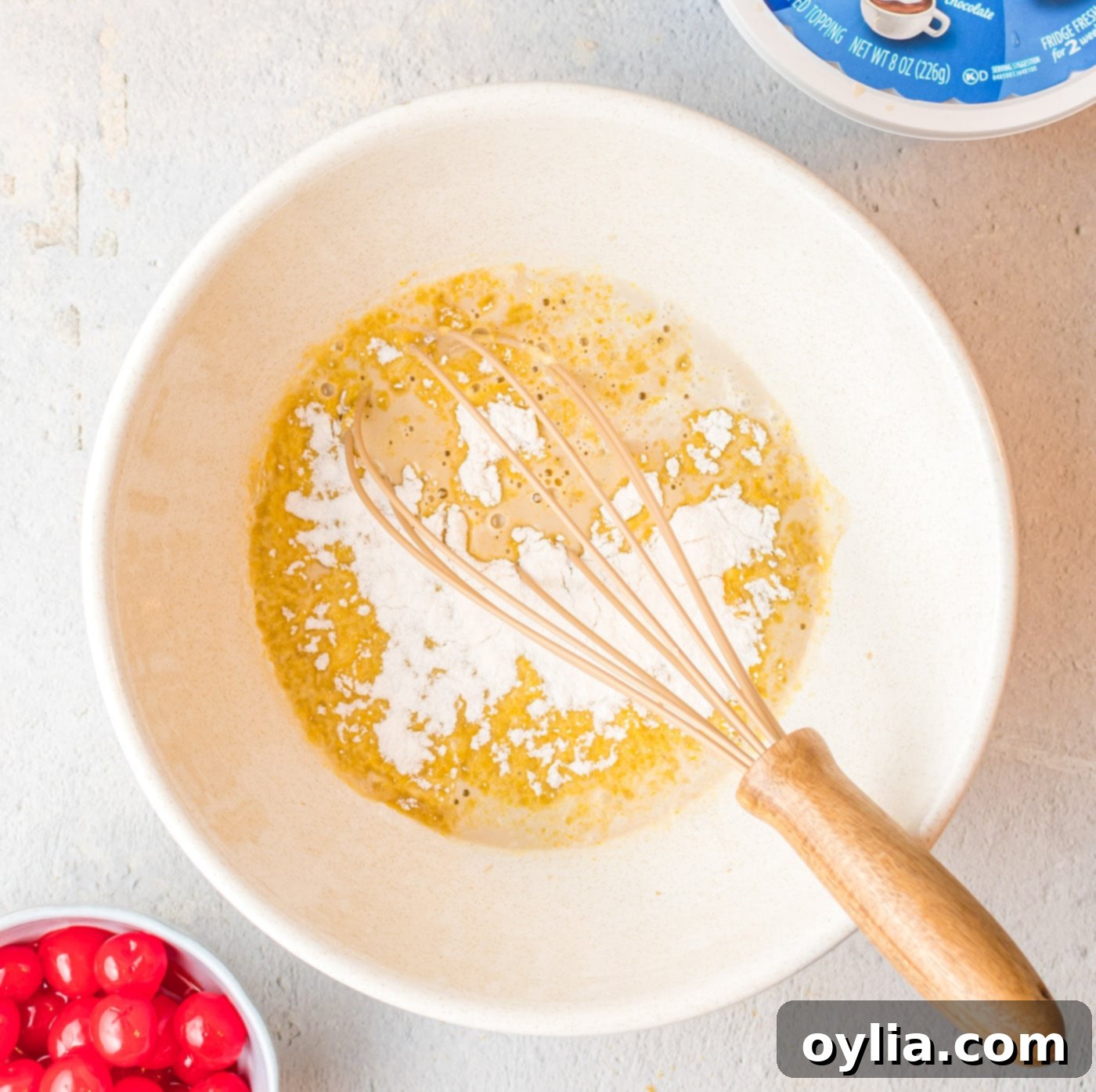 vanilla instant pudding mix added to root beer in a bowl