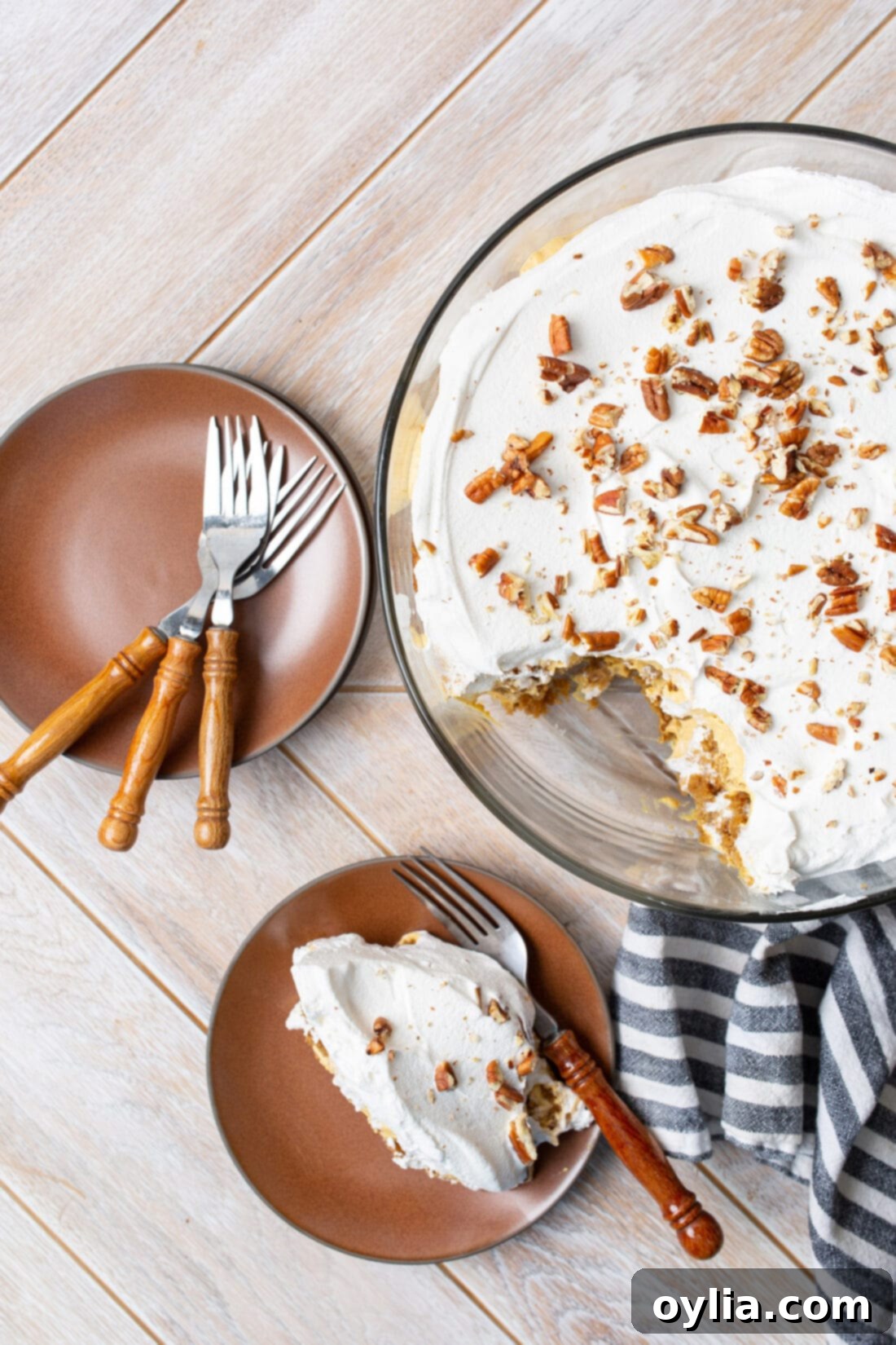 Overhead view of a beautifully prepared pumpkin trifle, garnished with pecans.