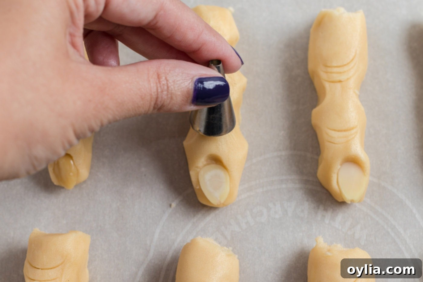 piping tip making indents in cookie dough