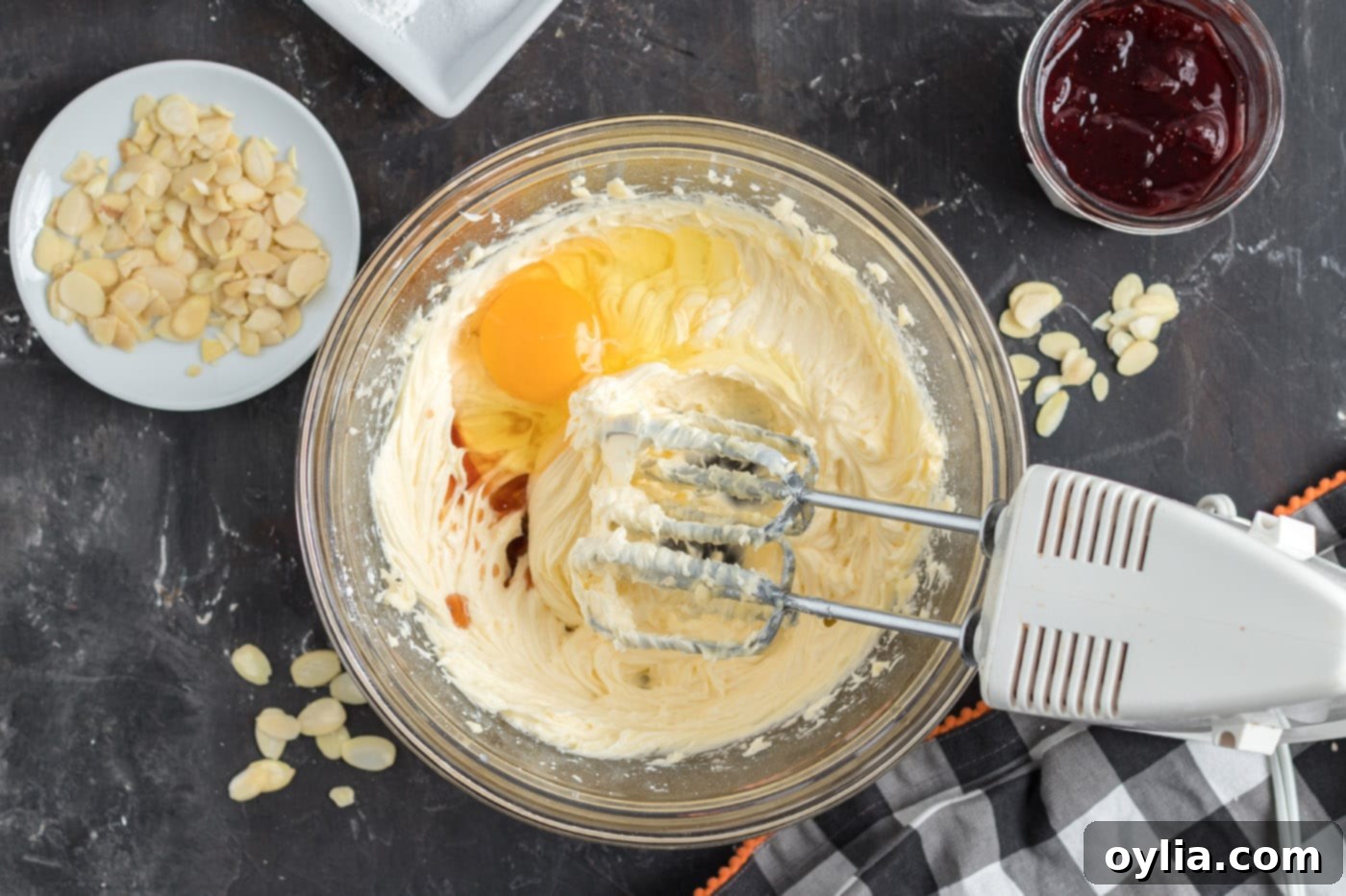 egg, vanilla, powdered sugar and butter mixed in a bowl