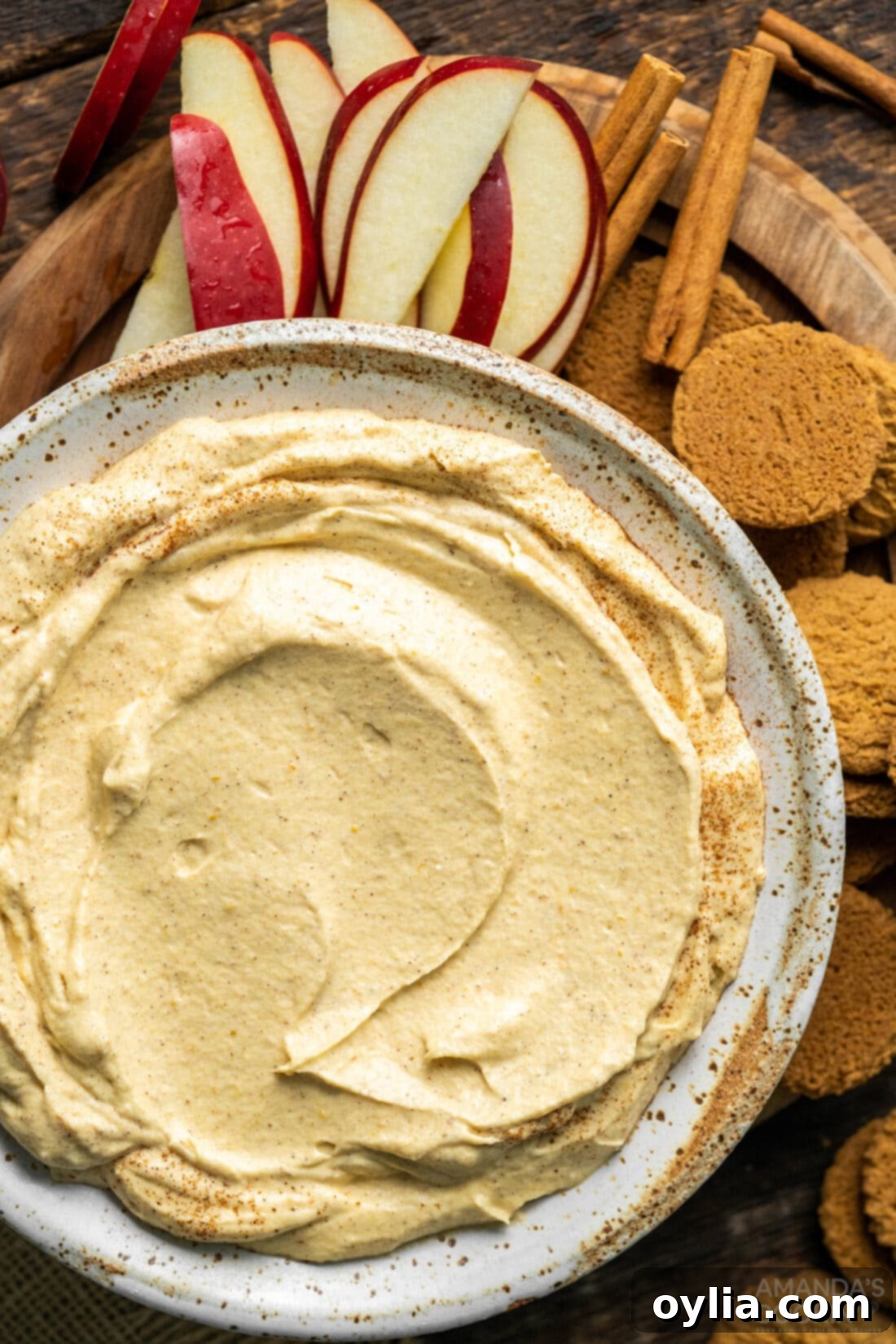 A beautifully presented bowl of fluffy, velvety Pumpkin Pie Dip, ready to be served for fall gatherings.