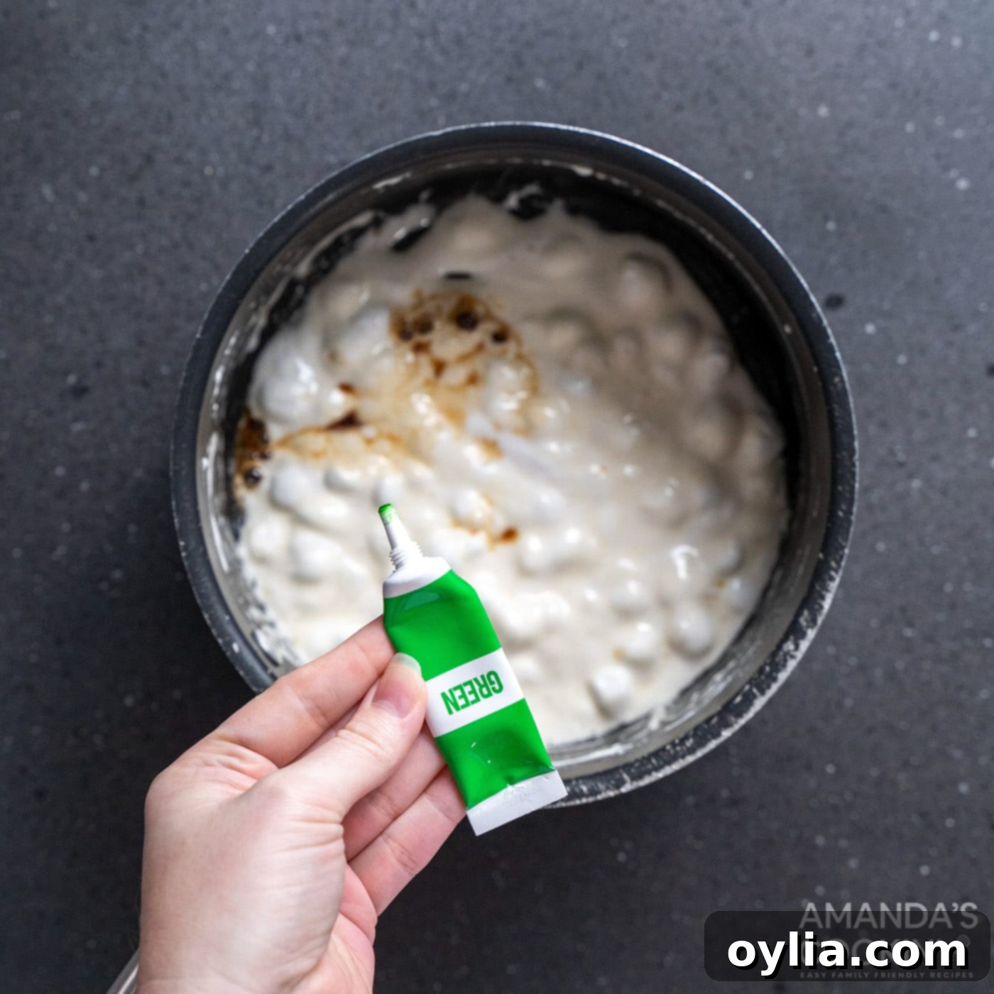 Monster Mash Krispie Treats 6 melted marshmallows in a saucepan