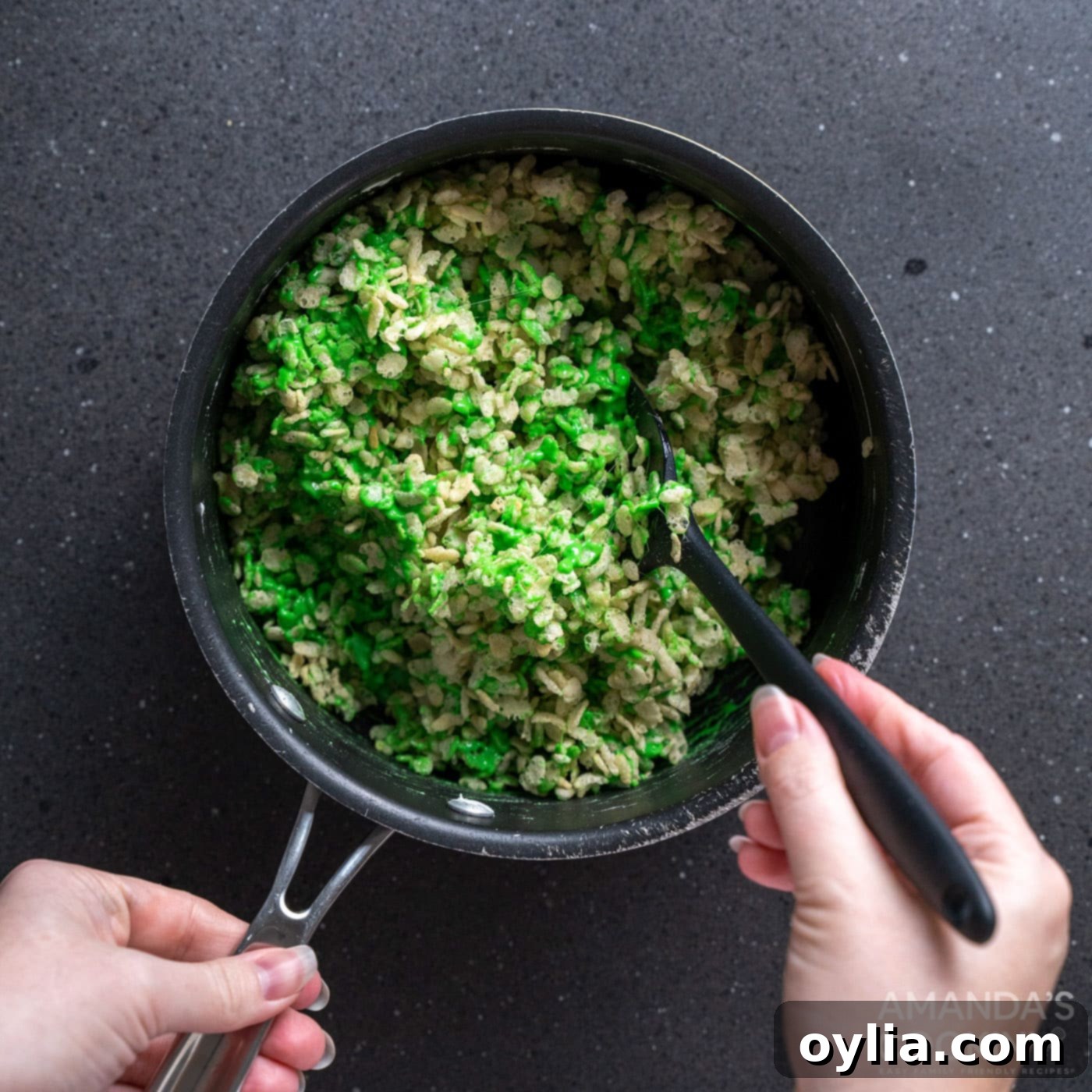 Monster Mash Krispie Treats 8 stirring rice krispie cereal into green marshmallows