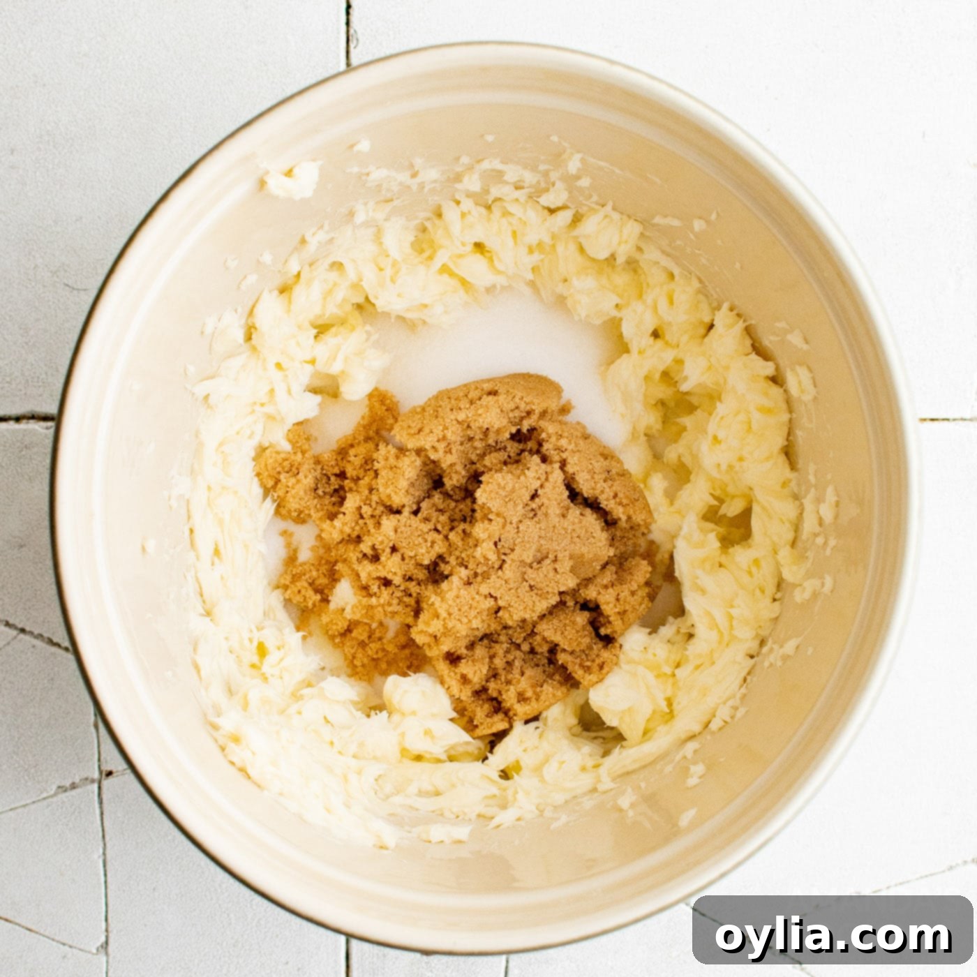 brown sugar, butter, and granulated sugar in mixing bowl