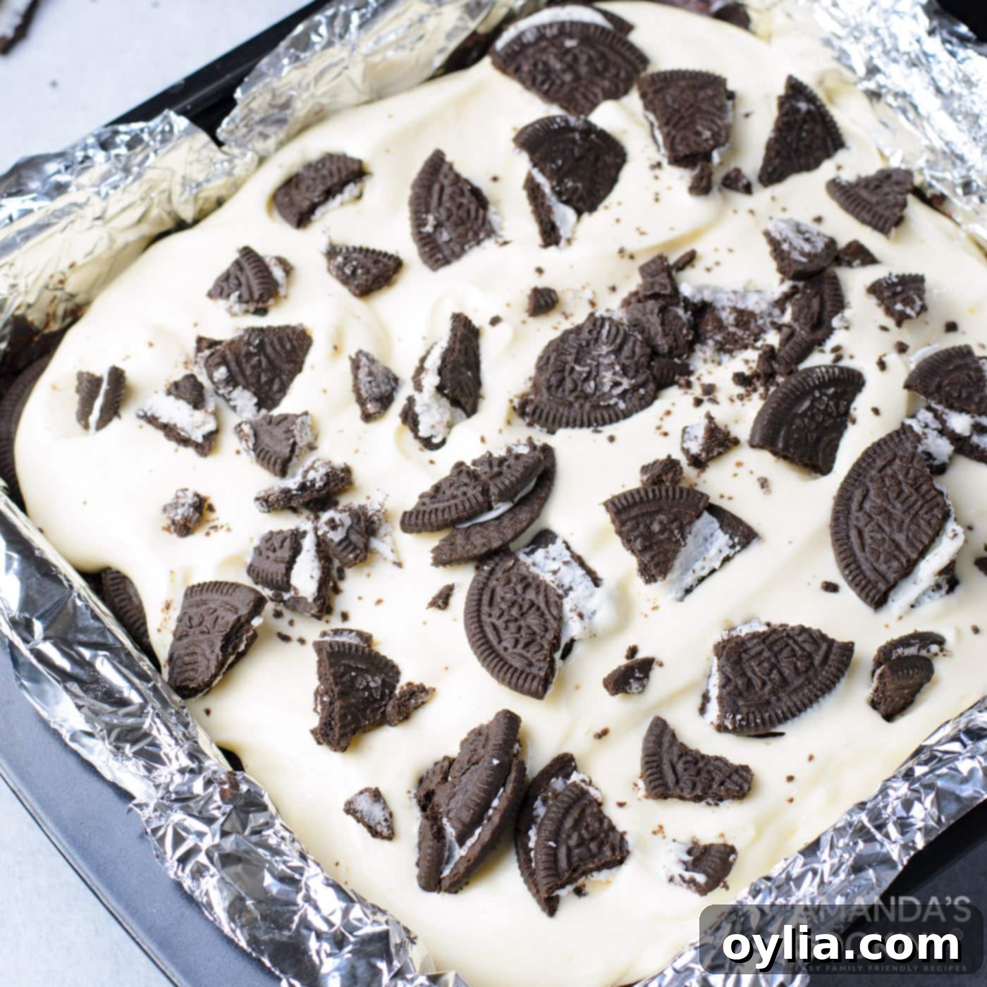 crushed Oreos over the top of cheesecake