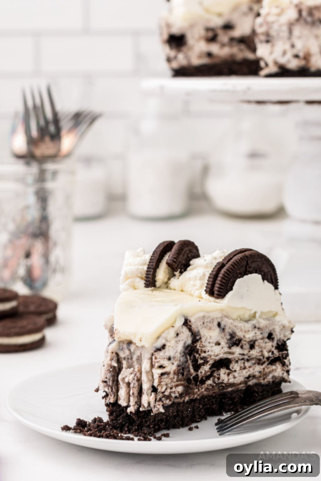 A perfectly sliced piece of Oreo Cheesecake revealing its layers and creamy texture.