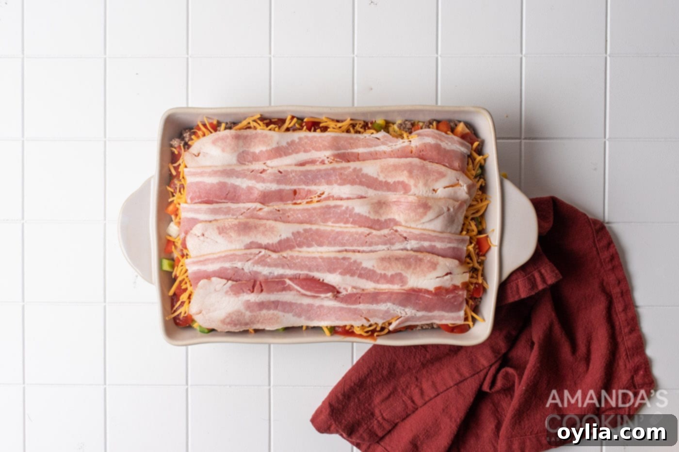 Stacked Supper Supreme 11 raw bacon on top of casserole