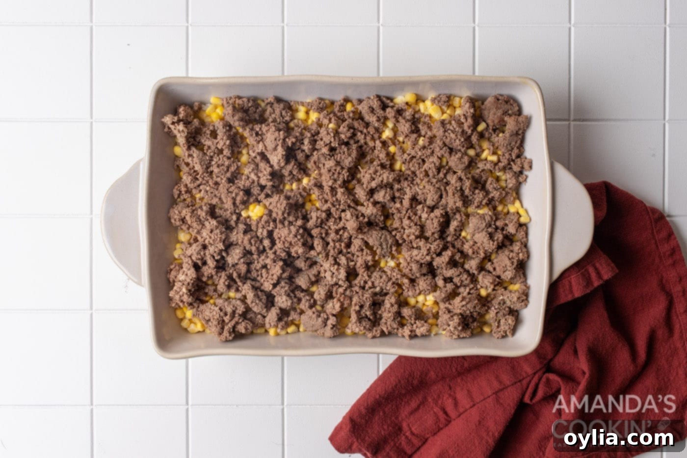 Stacked Supper Supreme 7 ground beef, corn, and rice in a dish
