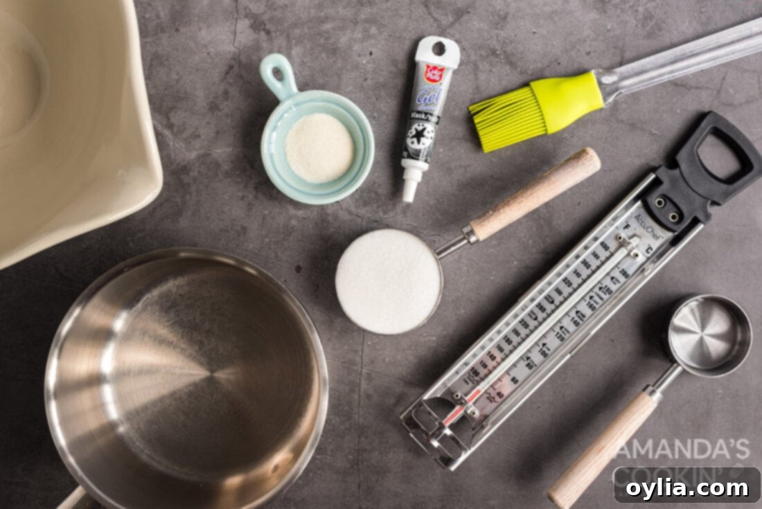 ingredients for Ghost Brownies, neatly laid out on a surface, including butter, chocolate chips, eggs, cocoa powder, sugar, vanilla, flour, gelatin, and black gel icing.