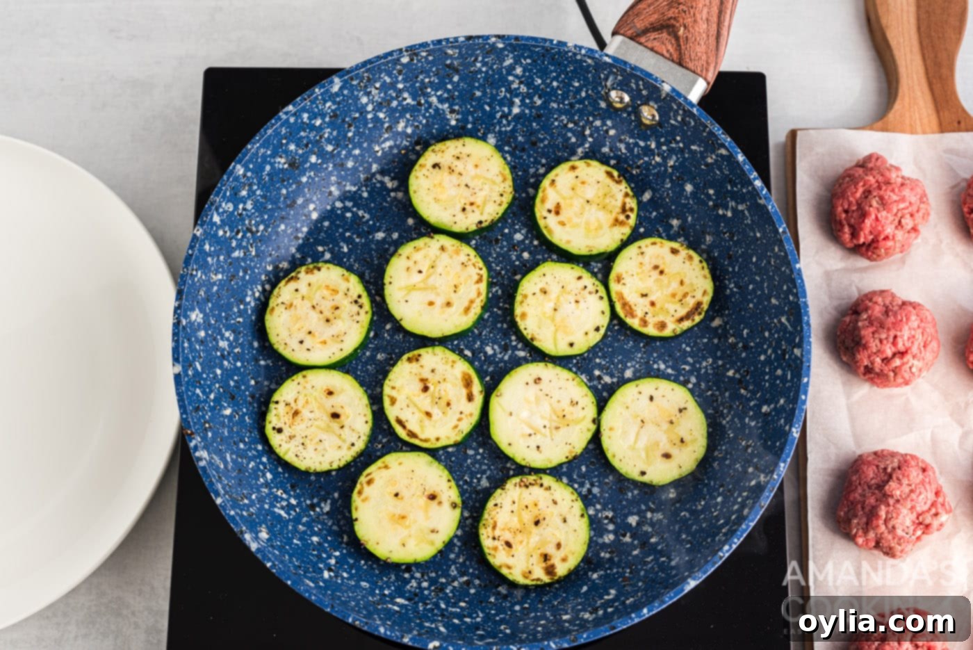 zucchini rounds browned in a skillet