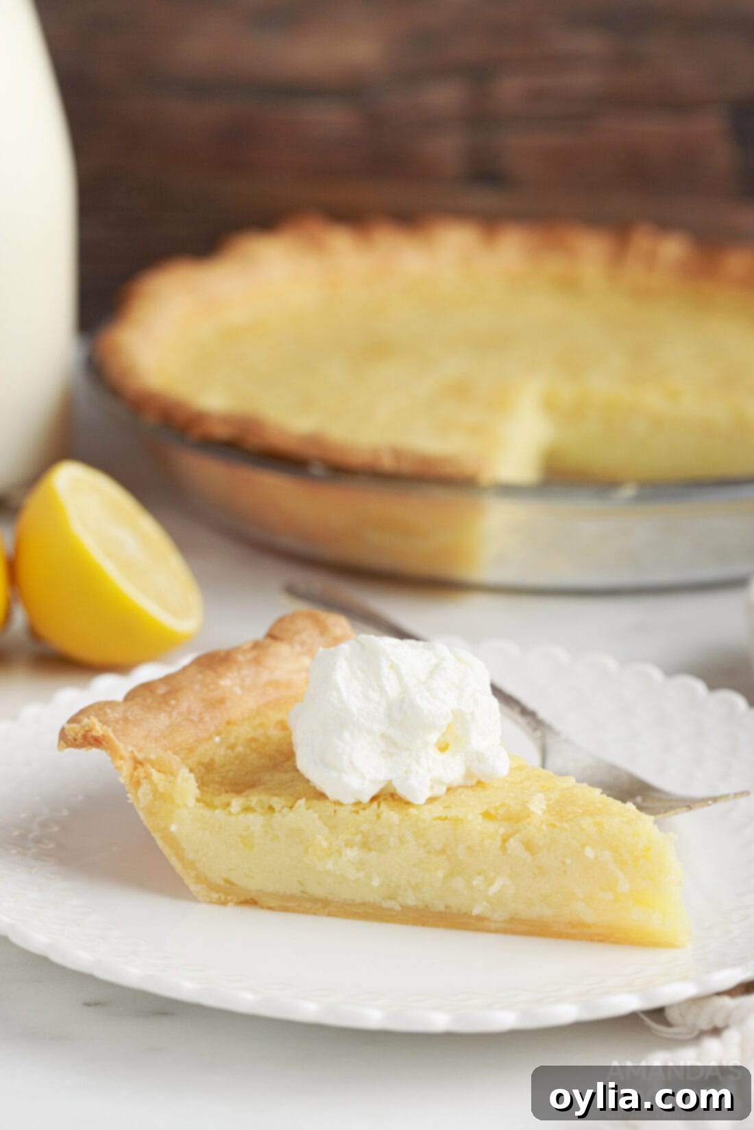 slice of Southern Buttermilk Pie with whipped cream