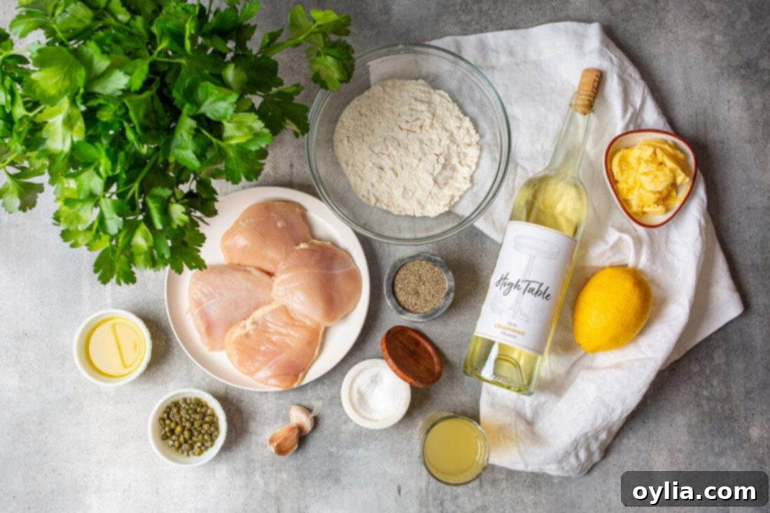 array of fresh ingredients for Chicken Piccata, including chicken, lemon, capers, and wine