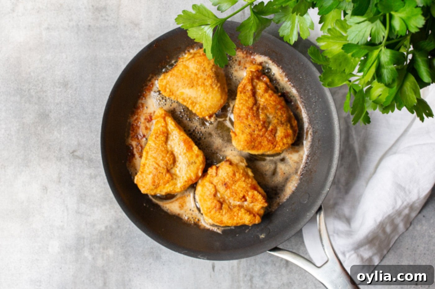 pan fried chicken breasts with a golden crust