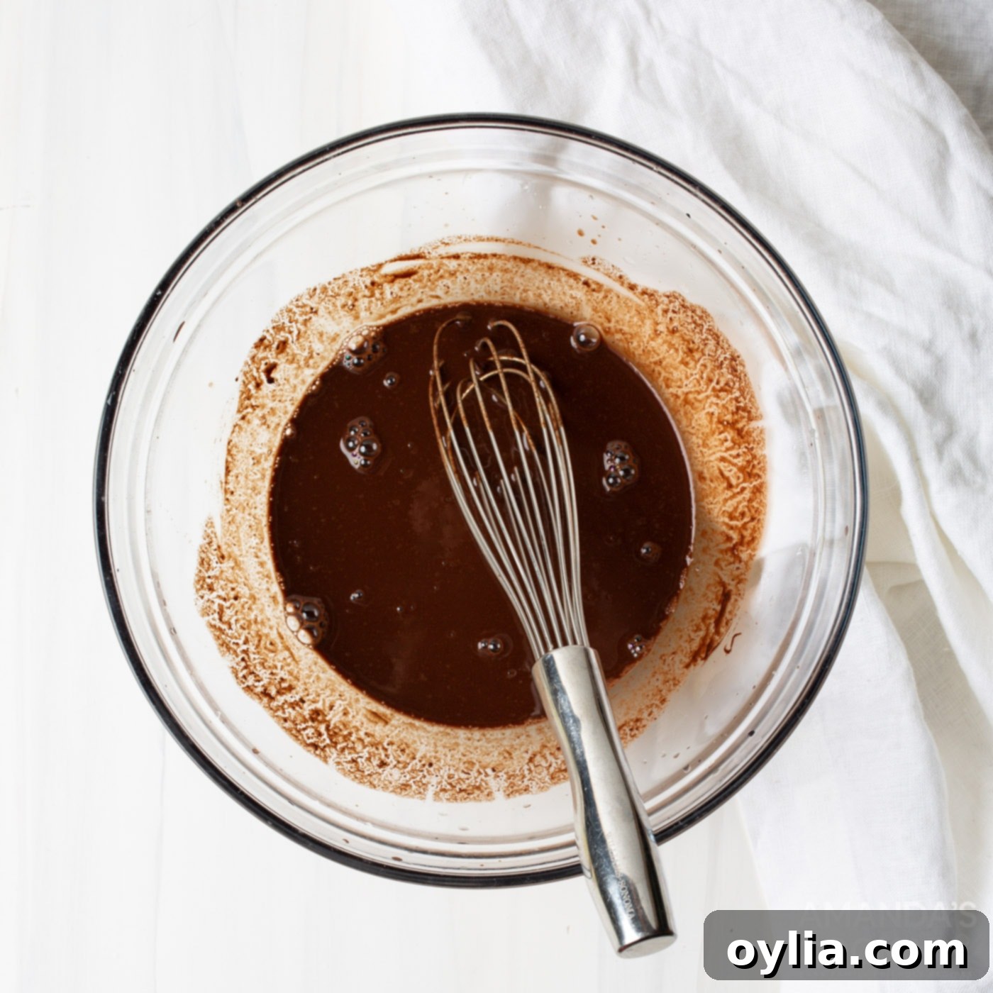 Whisking melted German chocolate and water until smooth for the cake batter.