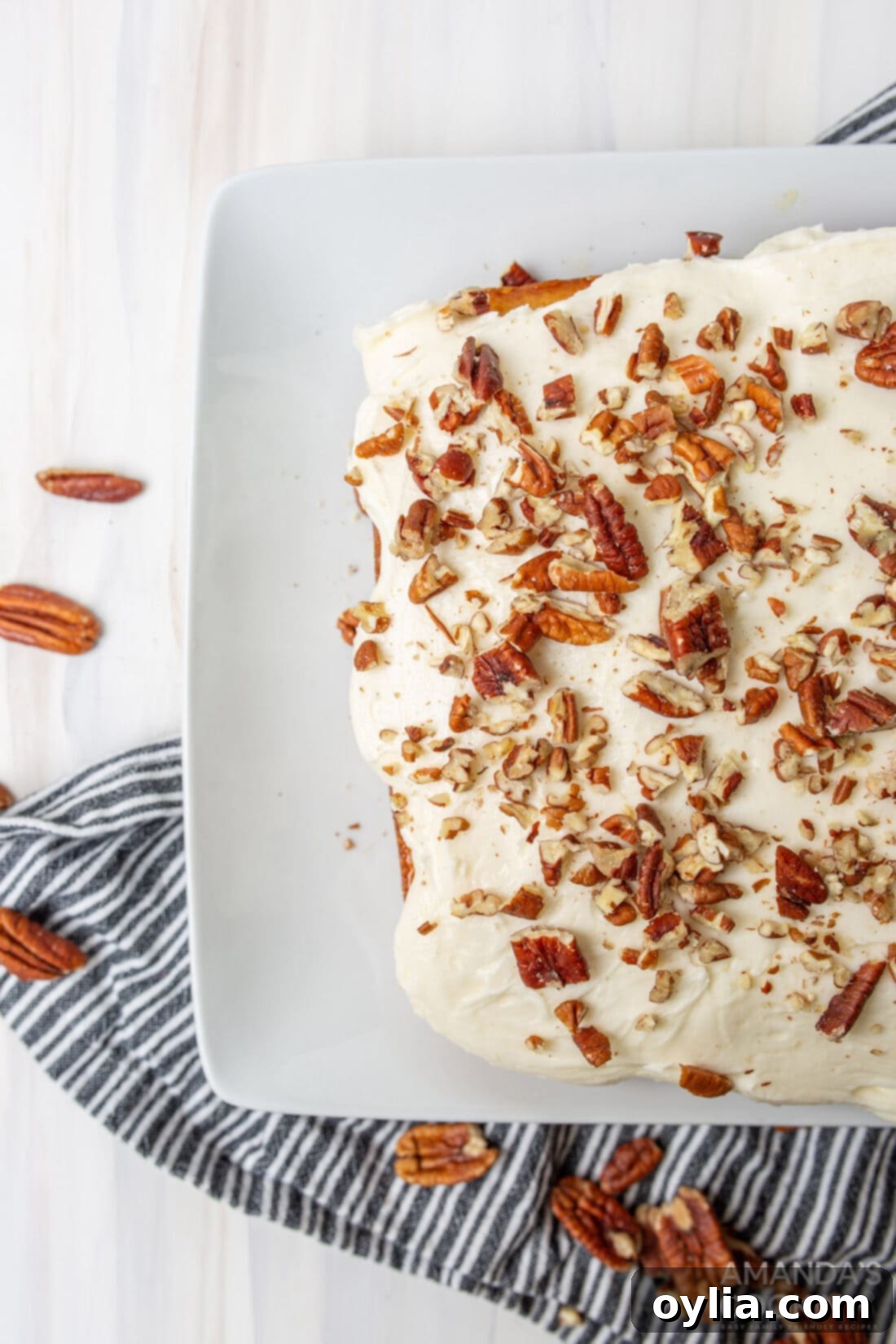 Overhead view of a freshly baked and frosted Elvis Presley Cake, ready to be sliced.