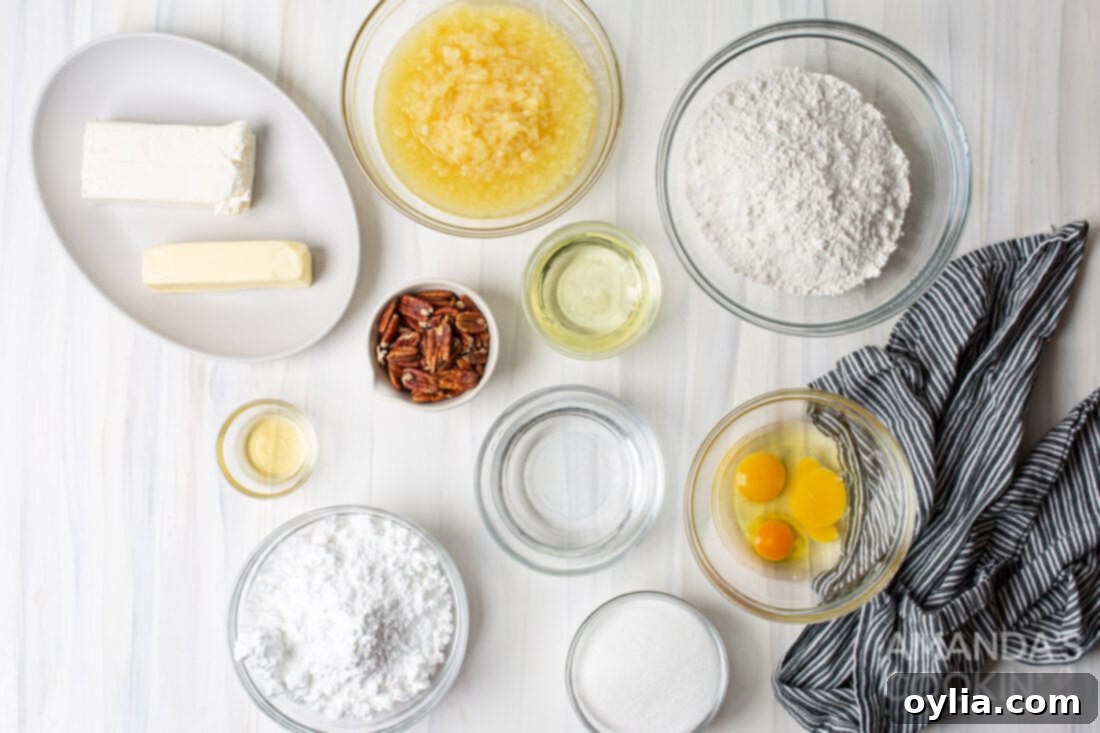 A selection of ingredients laid out for making Elvis Presley Cake, including cake mix, pineapple, cream cheese, butter, and pecans.