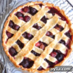 Beautifully baked Bourbon Cherry Pie with a flaky crust.