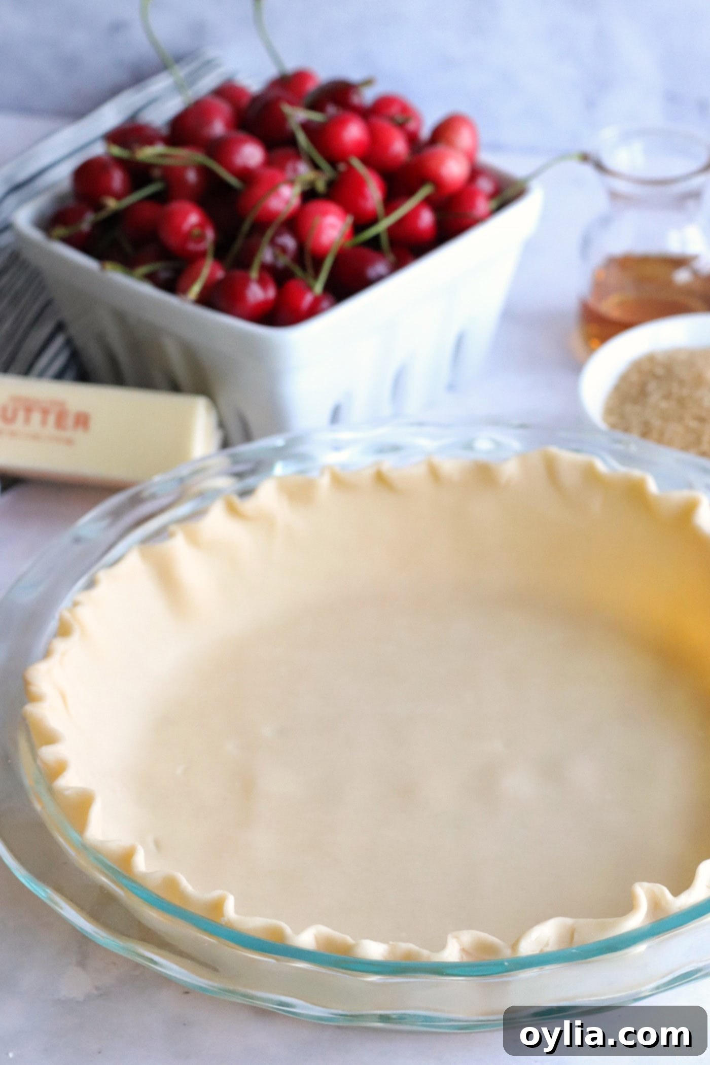 Pie crust lining a pie plate, ready for filling.