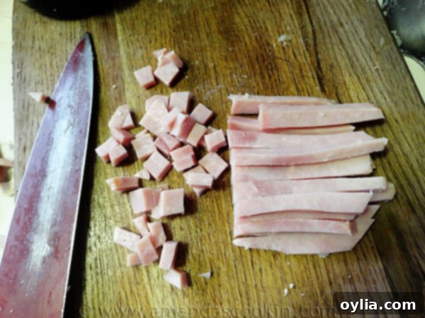 Diced ham, ready to be added to the creamy chowder.
