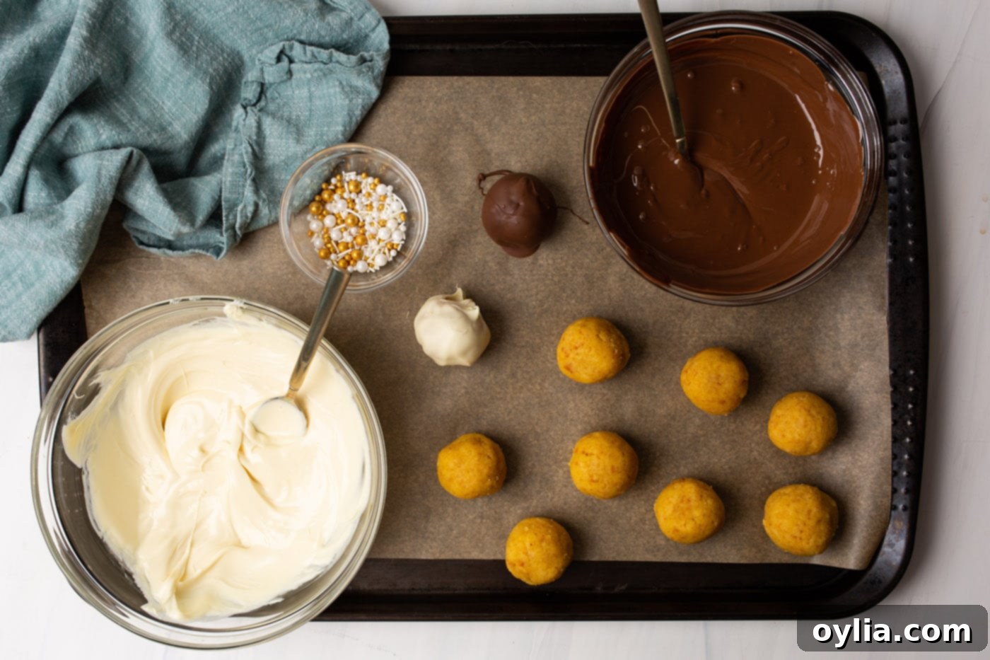 Cake balls dipped in both white chocolate and milk chocolate coatings