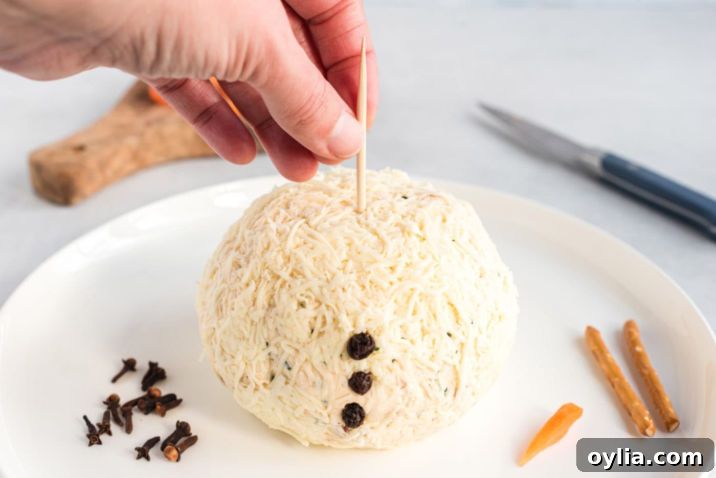 toothpick inserted into cheeseball for stability
