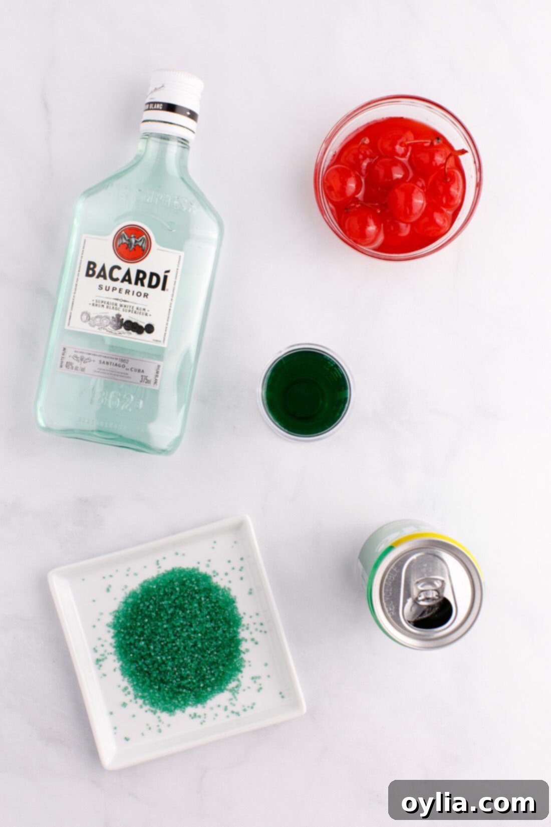 Ingredients laid out for a Grinch Cocktail preparation