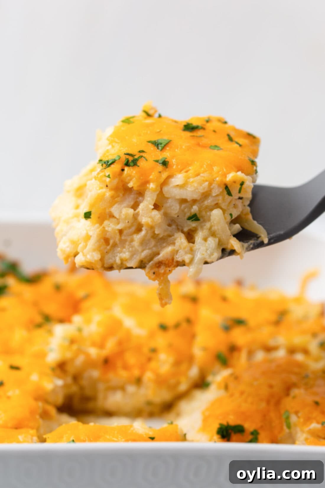 spatula lifting Hashbrown Casserole