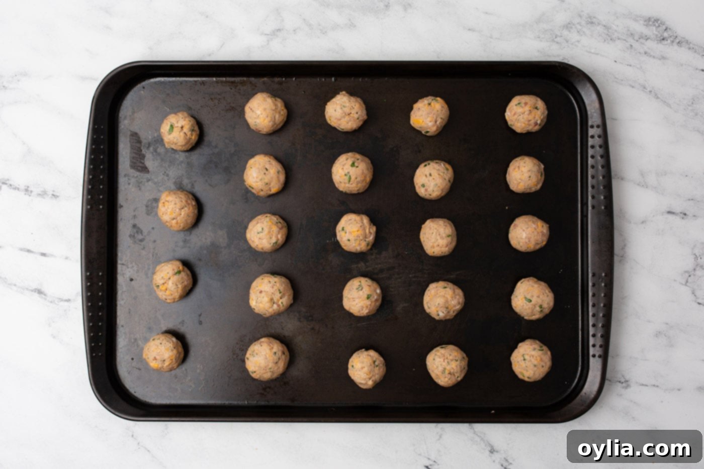 sausage balls on a baking sheet