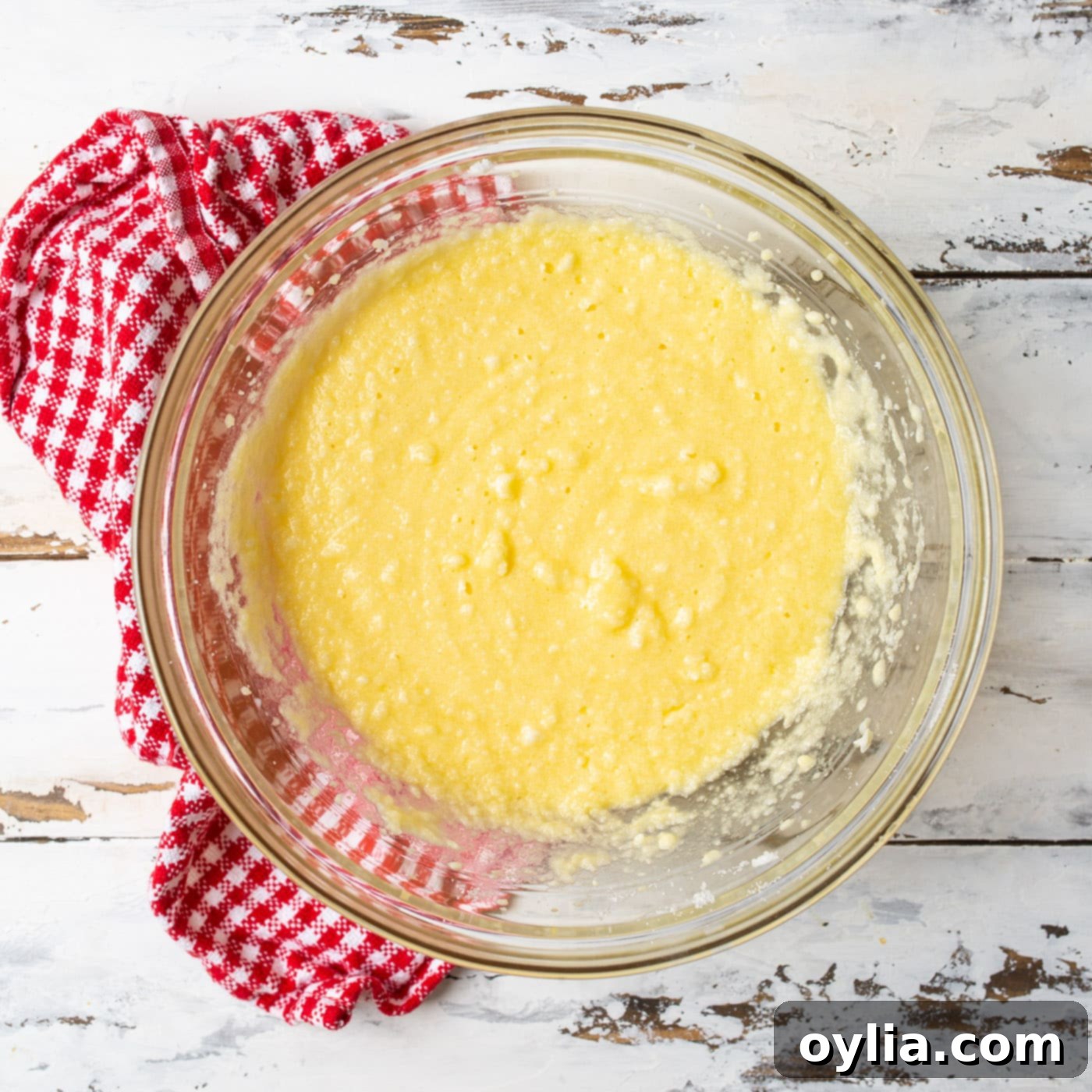Milk, vanilla, and eggs added to the shortening and sugar mixture