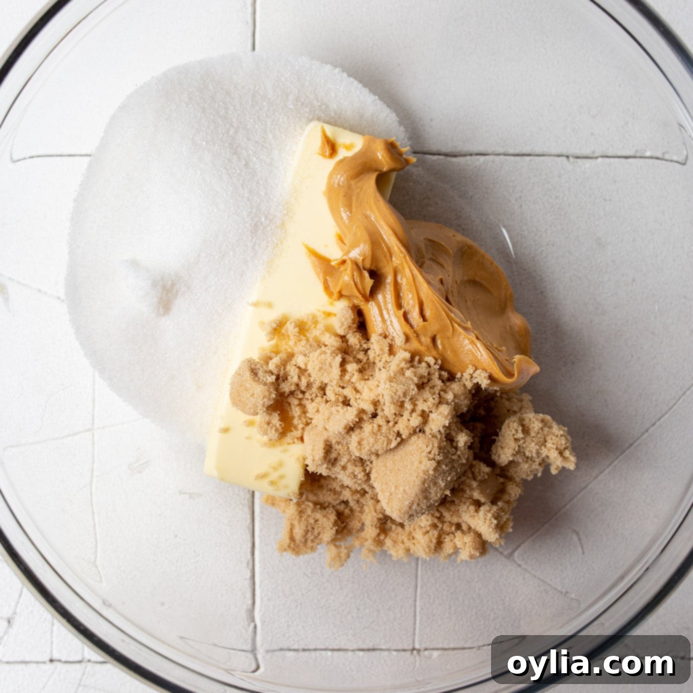 peanut butter, brown sugar, and sugar in a bowl