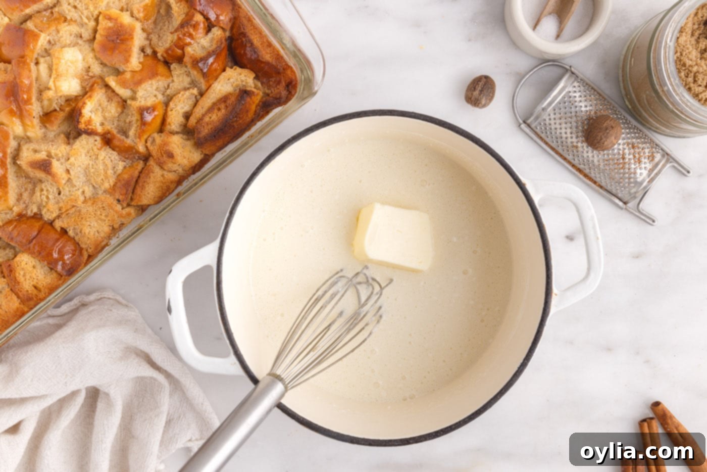 whisking in butter into vanilla sauce