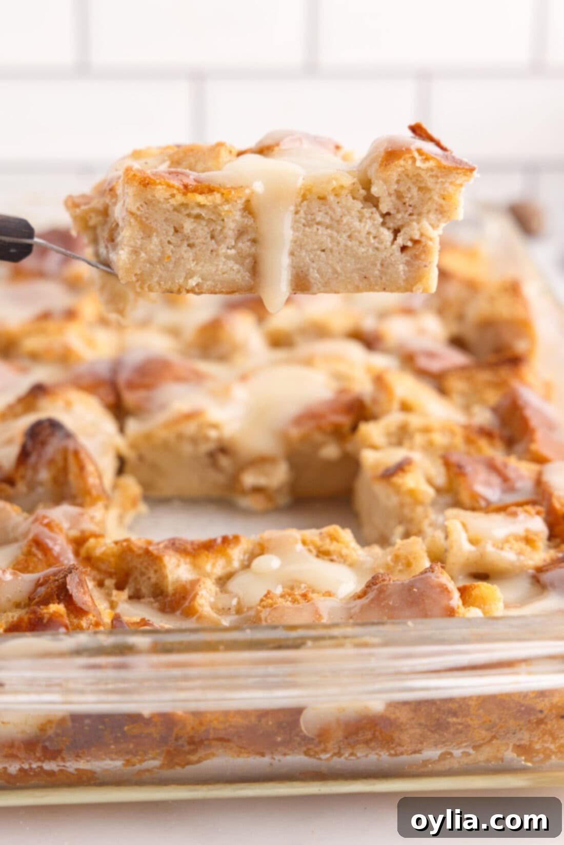 lifting a slice of Bread Pudding