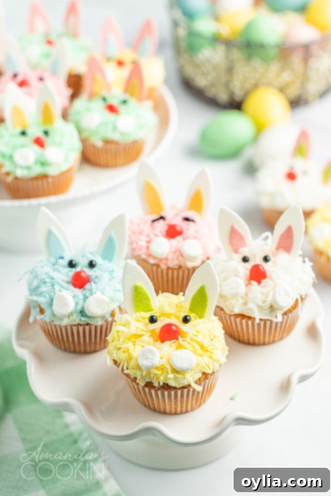 colorful easter bunny cupcakes on a platter, ready for serving