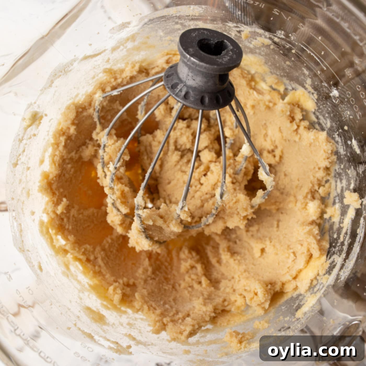 oatmeal cookie dough being mixed in a stand mixer