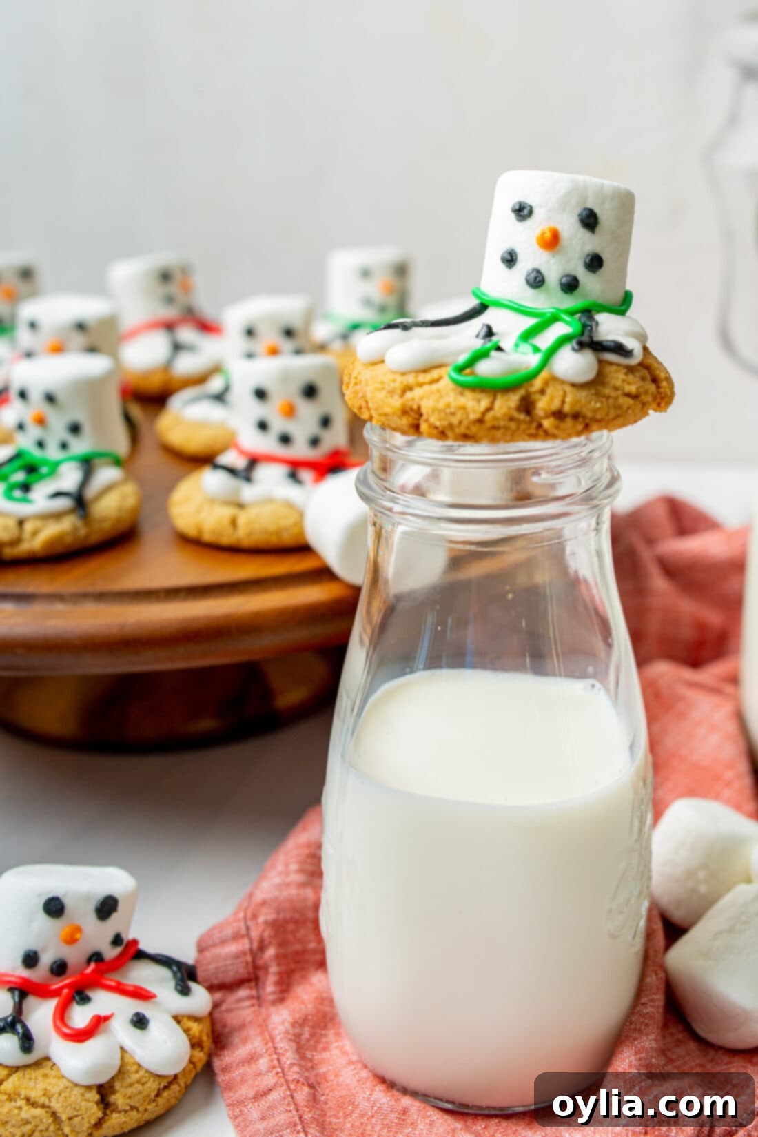 Melted Snowman Cookies on a bottle of milk