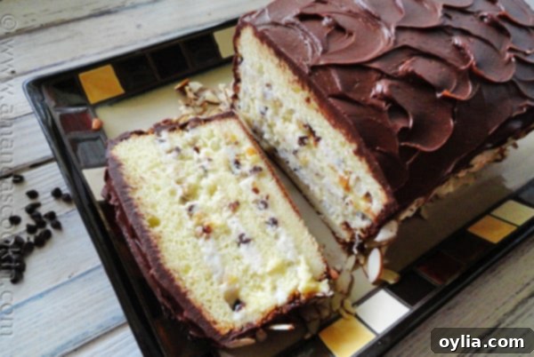 Close-up of a slice of Cassata Cake on a plate, showing the creamy filling