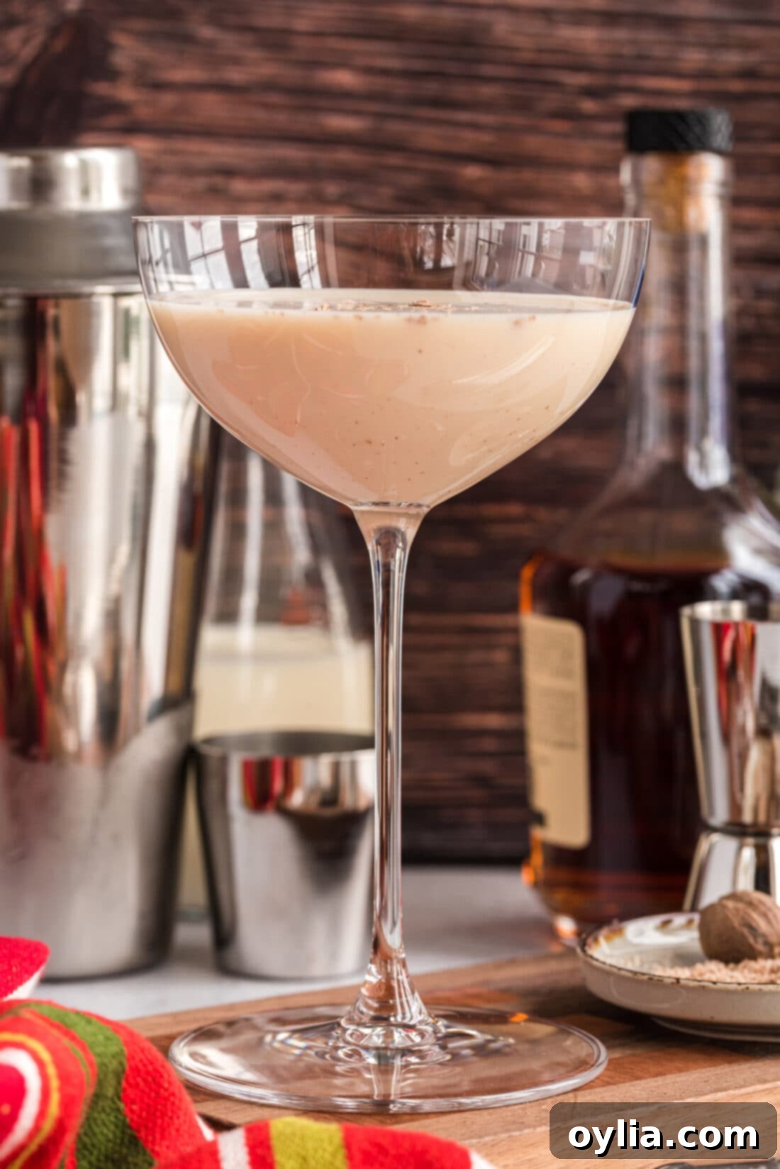 A perfectly chilled Brandy Alexander in a martini glass, garnished with freshly grated nutmeg.
