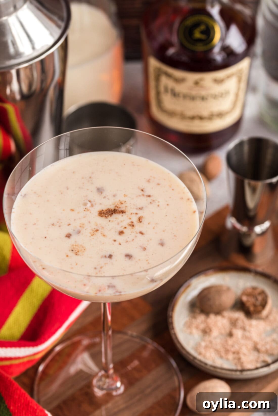 Close-up of a Brandy Alexander cocktail, topped with a generous sprinkle of freshly grated nutmeg.