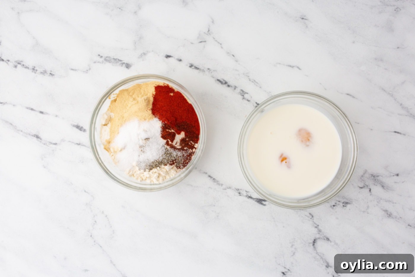 milk and eggs and seasonings in bowls