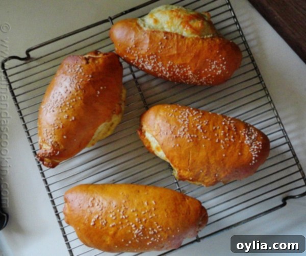 A batch of golden brown Ham & Cheese Pretzel Rolls fresh from the oven