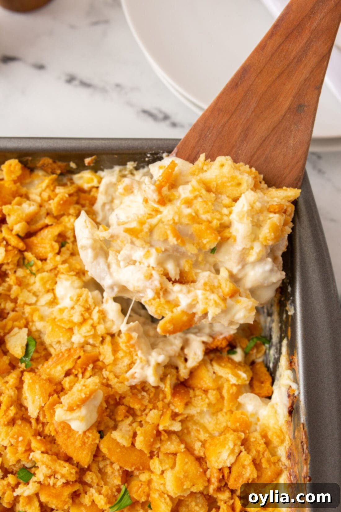 spooning out Million Dollar Chicken Casserole