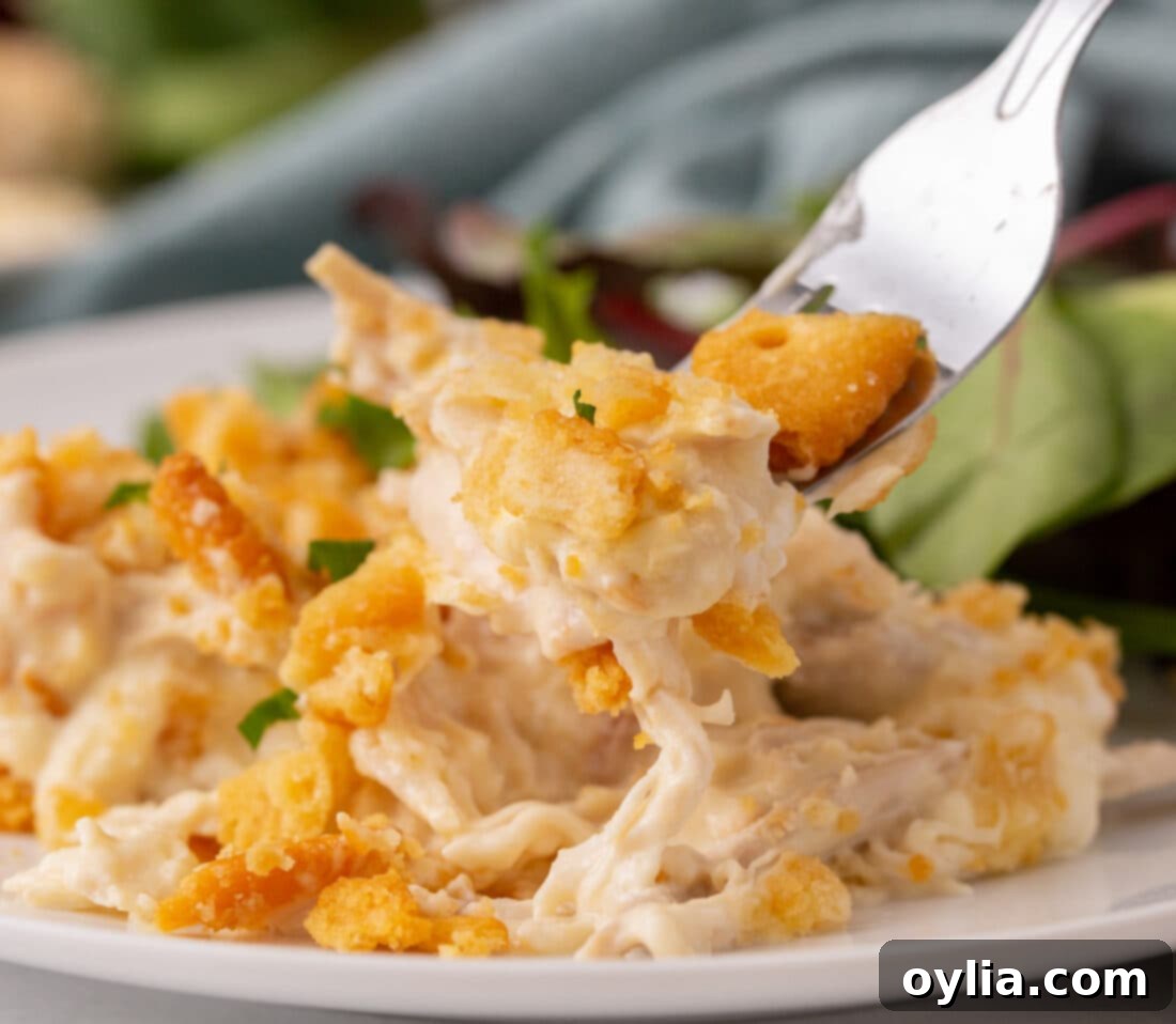 fork full of Million Dollar Chicken Casserole