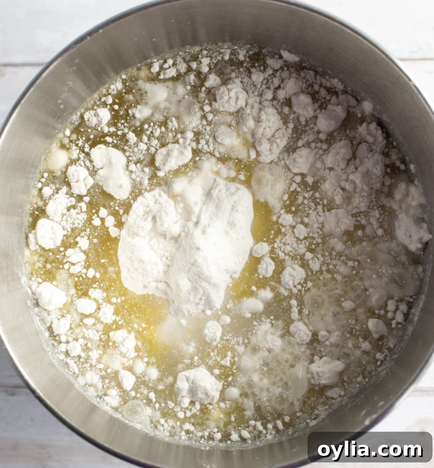 Preparing cake mix with oil and eggs in a mixing bowl.