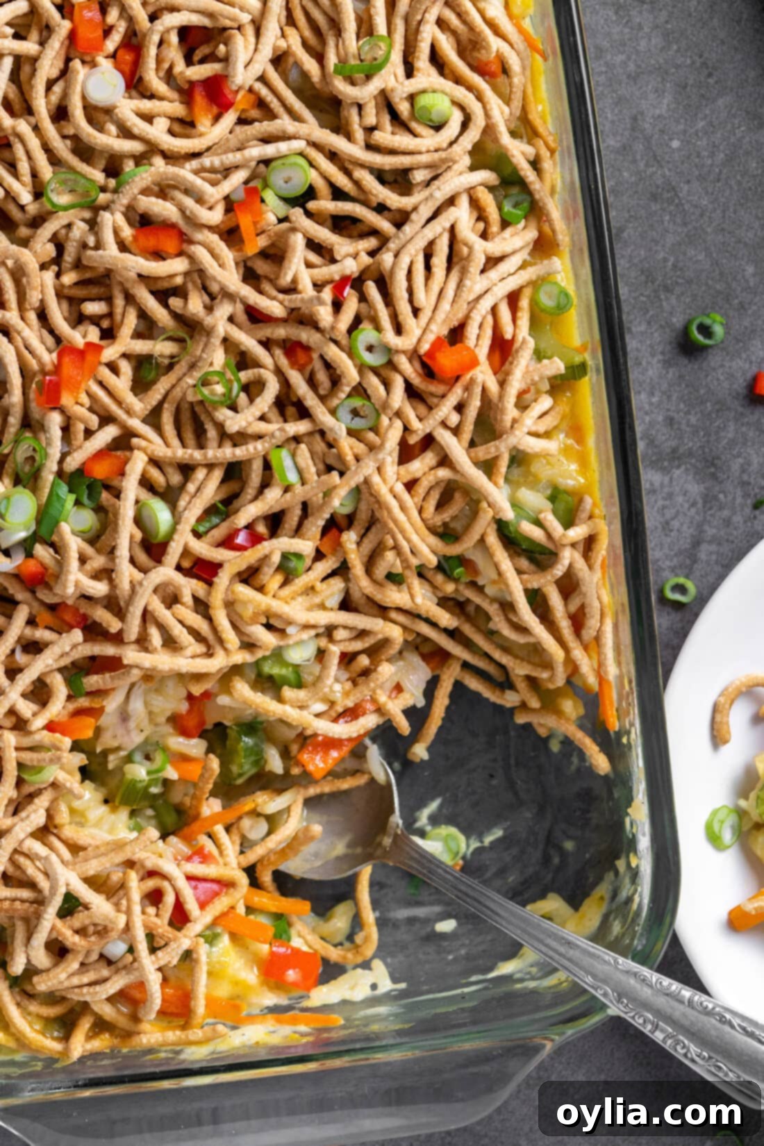Delicious Chicken Chow Mein Casserole with a serving spoon, ready to be dished out.