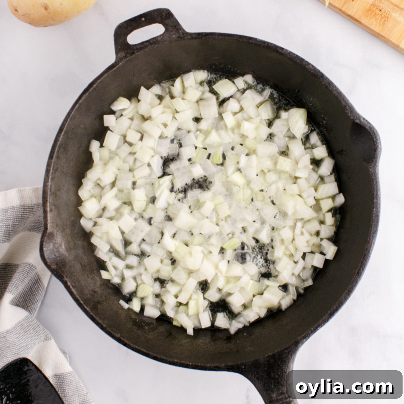 chopped onion frying in a skillet