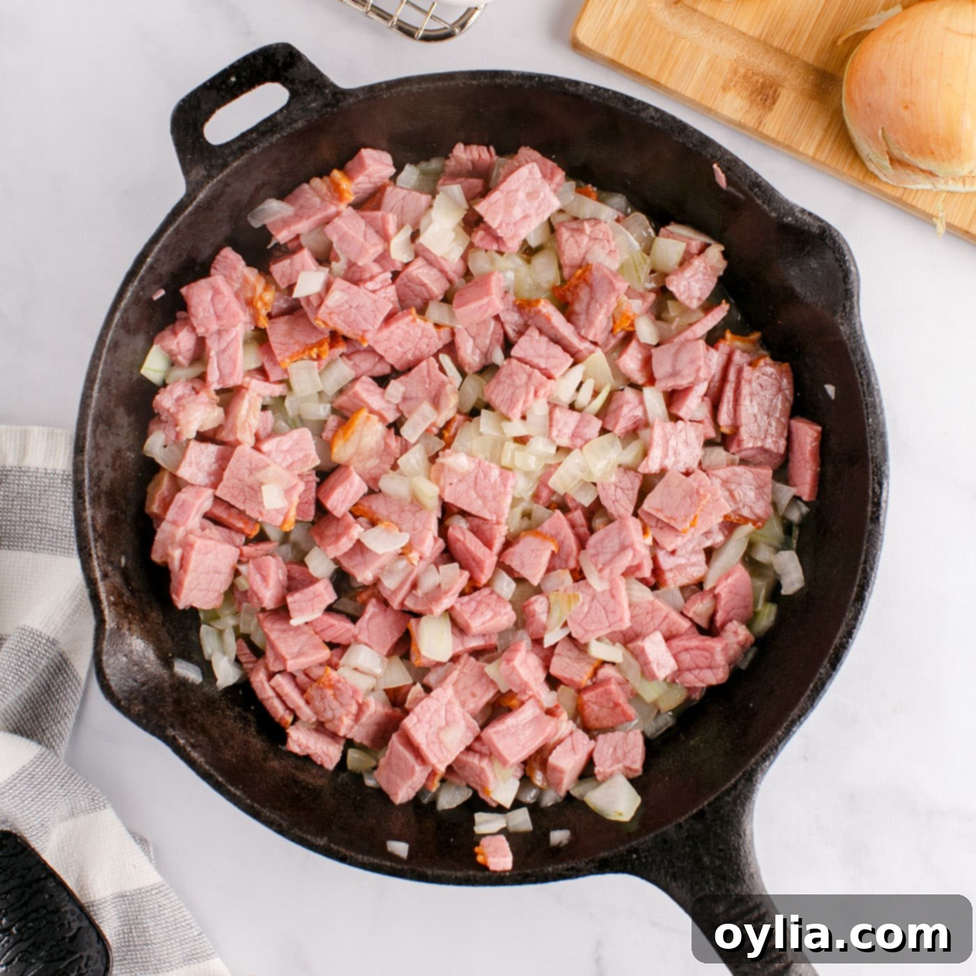 corned beef and onions in a skillet